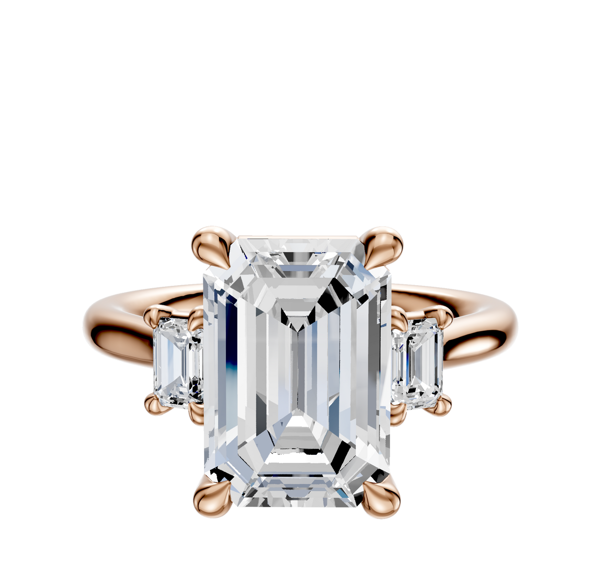 The 14K Rose Gold 3-Stone Emerald Cut Side Stones 0.25TCW Engagement Ring features a large emerald-cut center stone with two rectangular clear side stones, all set in a classic prong setting.