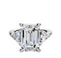 An 18K white gold engagement ring with a three-stone design, featuring 0.25TCW trillion side stones, displayed against a plain white background.