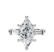 A 14K White Gold 3-Stone Baguette East/West Side Stones 0.125TCW Engagement Ring is displayed on a plain white background, with baguette-cut side stones accenting the center.