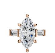 The 18K Rose Gold 3-Stone Baguette East/West Side Stones 0.25TCW Engagement Ring features a marquise-cut center and baguette side diamonds, showcased against a plain white background.
