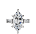 An 18K white gold engagement ring with a marquise center stone and two east/west baguette side stones (0.25TCW), shown on a polished band against a plain white background.