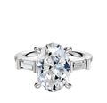 The 14K White Gold 3-Stone Baguette East/West Side Stones 0.125TCW Engagement Ring showcases a central diamond with two baguette-cut side stones, elegantly displayed against a plain white background.