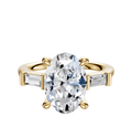 The 14K Yellow Gold 3-Stone Baguette East/West Side Stones 0.125TCW Engagement Ring features a central diamond and rectangular baguette side stones, displayed on a plain white background.