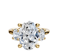 The 18K Yellow Gold 3-Stone Oval Side Stones 0.25TCW Engagement Ring features a central oval diamond with two smaller oval side stones, all set in prongs and displayed on a plain white background.