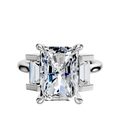 A 14K white gold 3-stone engagement ring featuring a north/south set center and baguette side stones totaling 0.25 TCW, displayed on a plain white background.