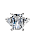 A 14K white gold engagement ring with a 3-stone design, featuring sparkling trillion side stones and a total carat weight of 0.25, shown on a polished band against a white background.