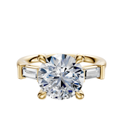 The 14K Yellow Gold 3-Stone Baguette East/West Side Stones 0.125TCW Engagement Ring features a central diamond secured by four prongs, flanked by rectangular baguette diamonds on each side.