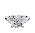 A 14K white gold engagement ring featuring three stones with a central diamond and two pear-shaped side diamonds totaling 0.125TCW, displayed on a plain white background.