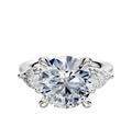 The 14K White Gold 3-Stone Engagement Ring features a round center stone accented by two pear-shaped side stones (0.25TCW), presented on a white background.