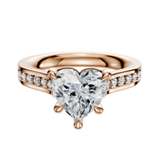 The 14K Rose Gold 4 Prong Basket Cathedral Flat 1-Row-Pave 2.5mm Engagement Ring features a heart-shaped diamond center and small round diamonds set along the band.