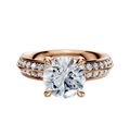 A 14K rose gold engagement ring featuring a classic knife-edge band, a four-prong basket setting for the center diamond, and a single row of pave-set diamonds along each side.