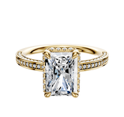The 18K Yellow Gold 4 Prong Collar Classic Flat 3-Row-Pave 2.0mm Engagement Ring features a prominent rectangular gemstone in the center, accented by rows of pavé diamonds along the band and around the centerpiece, displayed on a white background.