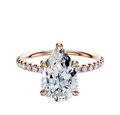 The 14K Rose Gold 4 Prong Hidden Halo Classic Dome 1-Row-Pave 2.5mm Engagement Ring features a rose gold band with small round diamonds set in a classic dome pave design.
