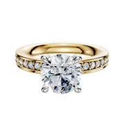 The 14K Two Tone 4 Prong Hidden Halo Classic Flat 1-Row-Pave 2.5mm Engagement Ring features a round-cut center diamond in a prong setting with smaller diamonds set along the band for added brilliance.