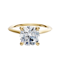 A 14K yellow gold cathedral knife edge engagement ring, featuring a 1.5mm band and round diamond set in four prongs with a hidden halo, displayed on a plain light background.