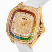 Introducing the 39MM Swiss Made 18K Yellow Gold Watch with Diamonds and Rainbow Gemstones, featuring a square face, diamond-encrusted bezel with multicolored gems, and a white textured leather strap.