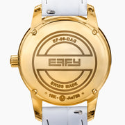 The 38MM Swiss Made 18K Yellow Gold Watch features diamonds and rainbow spinel on its face, a white leather strap, and the word “EARLY” at the center for a luxurious look.