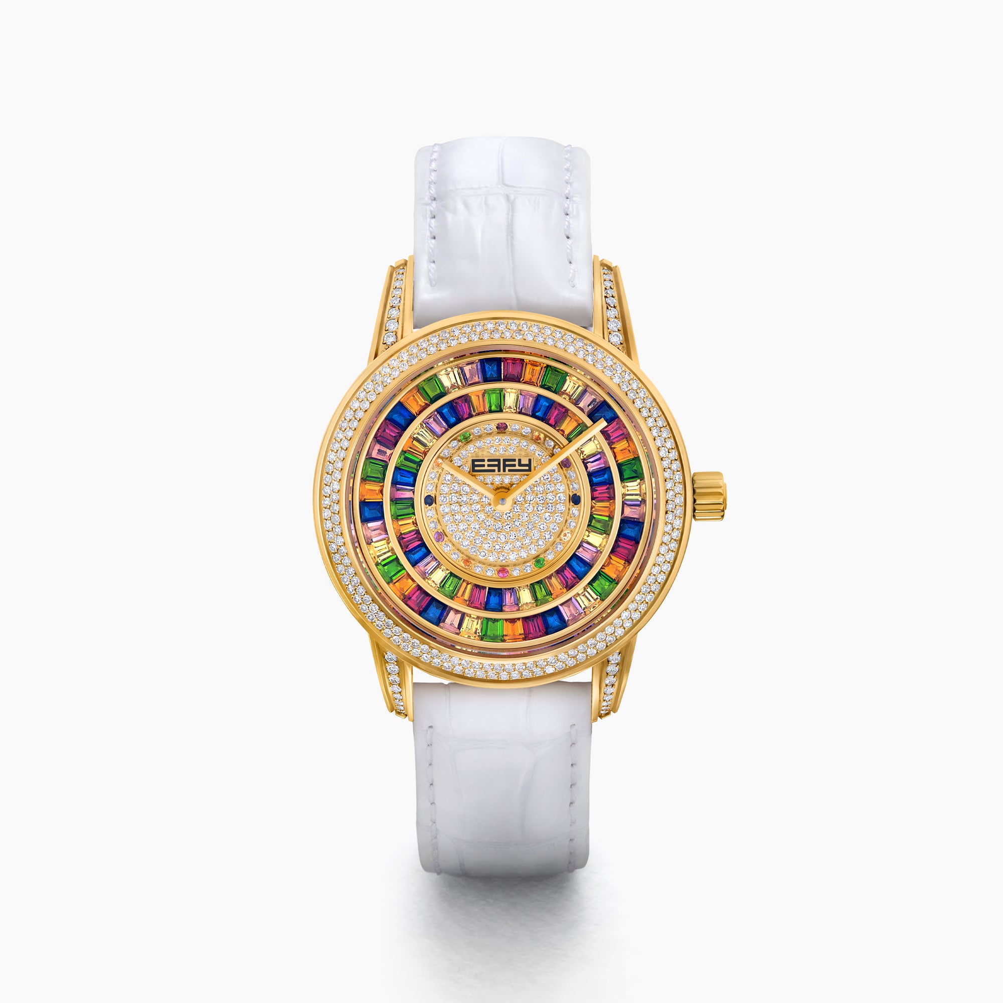 The 38MM Swiss Made 18K Yellow Gold Watch features diamonds and rainbow spinel on its face, a white leather strap, and the word “EARLY” at the center for a luxurious look.