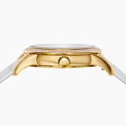 The 38MM Swiss Made 18K Yellow Gold Watch features diamonds and rainbow spinel on its face, a white leather strap, and the word “EARLY” at the center for a luxurious look.