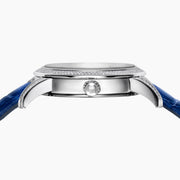 The 38MM Swiss Made Stainless Steel watch features a diamond-encrusted silver case, blue topaz hour markers, textured silver geometric dial with the EAFY logo, and a blue leather strap for a luxurious finish.