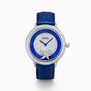 The 38MM Swiss Made Stainless Steel Spinning Starfish Watch features diamonds, blue topaz, a blue leather strap, silver face with blue accents, silver hands, the EARY logo on the dial, and a jeweled starfish motif near the bottom.