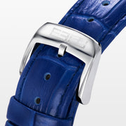 The 39MM Swiss Made Stainless Steel Turtle Watch features diamonds, sapphires, and tsavorite. It has a blue strap and dial, jeweled turtle motif in green and white stones, a diamond-encrusted silver bezel, and EFFY branding on the face.