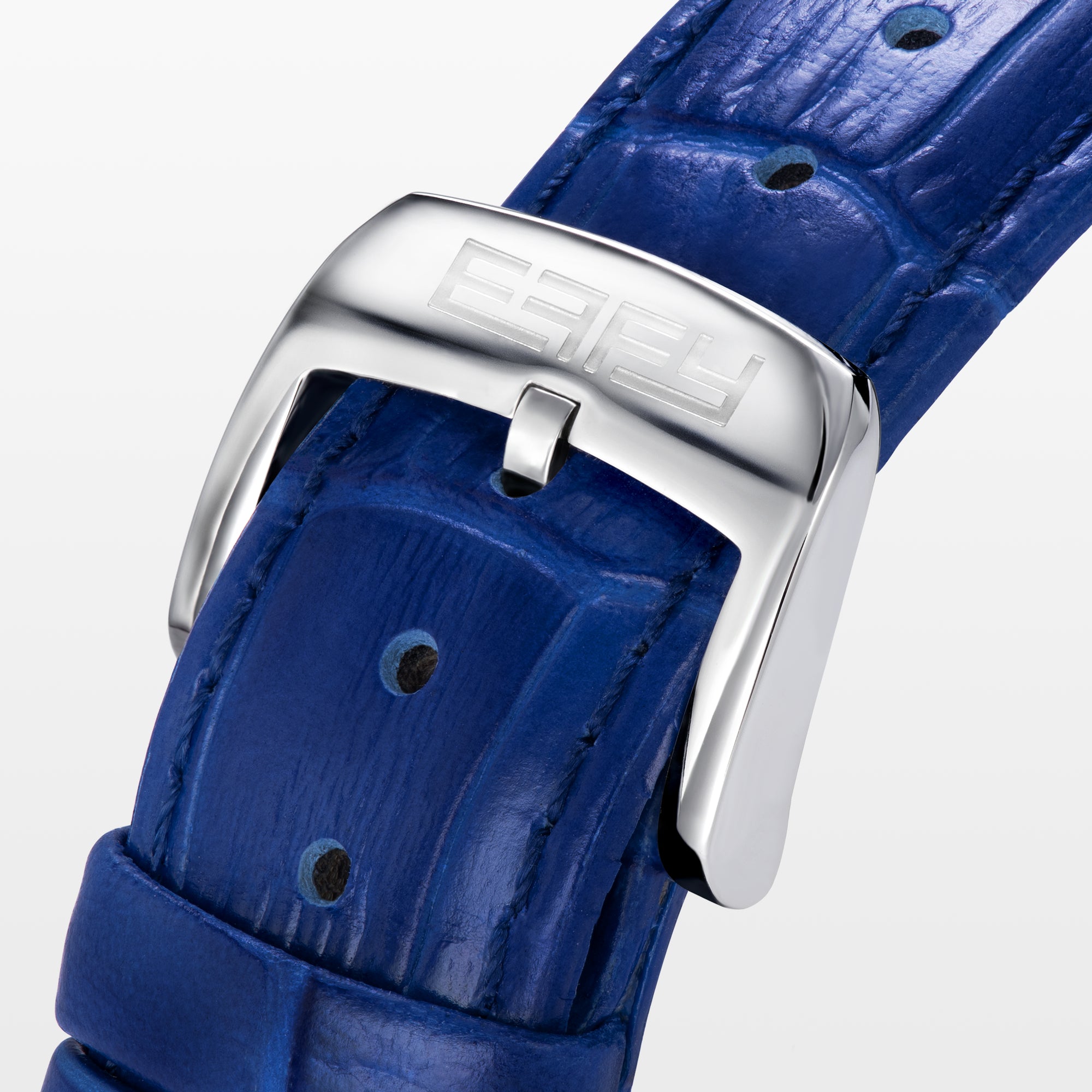 The 39MM Swiss Made Stainless Steel Turtle Watch features diamonds, sapphires, and tsavorite. It has a blue strap and dial, jeweled turtle motif in green and white stones, a diamond-encrusted silver bezel, and EFFY branding on the face.