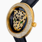 The 39MM Swiss Made 18K Yellow Gold Signature Round Panther Watch with Diamonds features a jeweled panther face on a glossy black dial, green eyes, gold hands, and a diamond-encrusted bezel with a black leather strap for luxurious elegance.