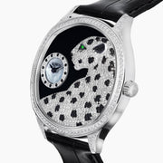 The 41MM Swiss Made Stainless Steel Signature Panther Watch with Diamonds features a jeweled panther design with black spots, emerald eyes, and a diamond-studded face, displaying the time in a small subdial.