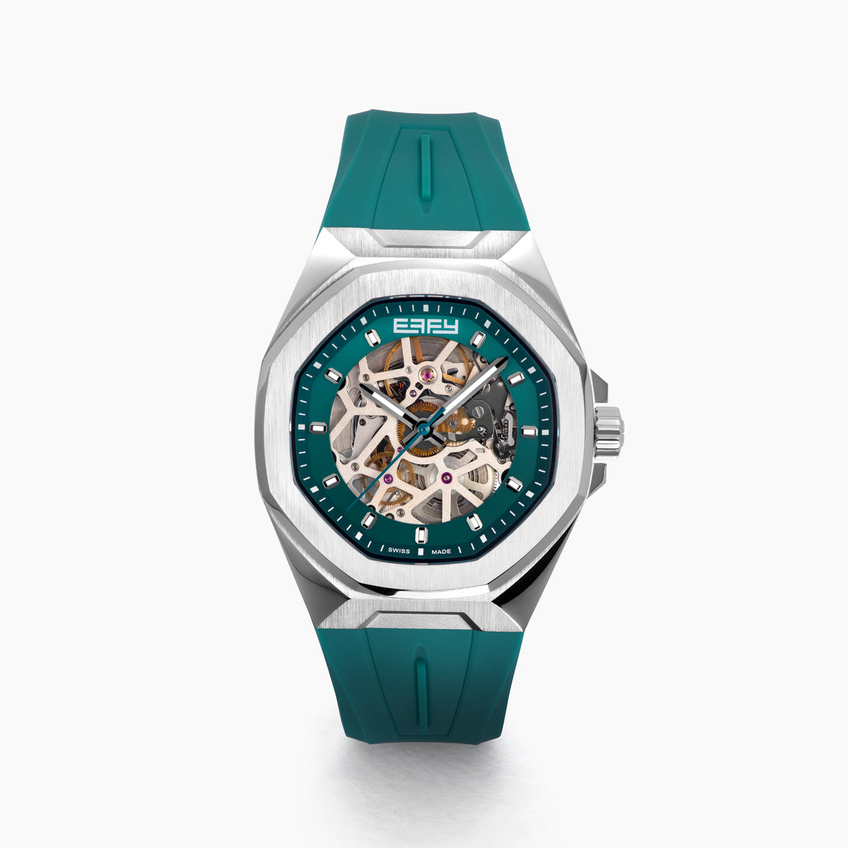 The 42MM Swiss Made Stainless Steel Automatic Skeleton Watch with Diamonds features a teal rubber strap, silver case, partially transparent dial with visible gears, teal bezel and markings, and EBFY branding at the top.