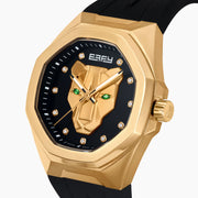 The 42MM Swiss Made 18K Yellow Gold Signature Panther Automatic Watch with Diamonds features a geometric panther face, green gemstone eyes, diamond markers on a black dial, and "EARLY" at the top—an artistic twist on a classic gold watch.