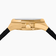 The 42MM Swiss Made 18K Yellow Gold Signature Panther Automatic Watch with Diamonds features a geometric panther face, green gemstone eyes, diamond markers on a black dial, and "EARLY" at the top—an artistic twist on a classic gold watch.
