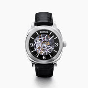 The 41MM Swiss Made Stainless Steel and Leather Automatic Skeleton Watch features a black leather strap, silver case, black skeleton dial, and white hour markers with numerals at 3, 6, and 9 to showcase Swiss precision craftsmanship.
