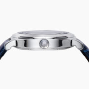 The 41MM Swiss Made Stainless Steel and Leather Automatic Skeleton Watch features a silver case, blue leather strap and bezel, a skeleton dial with visible gears, white hour markers and hands, plus the ERIFY brand name at the top.
