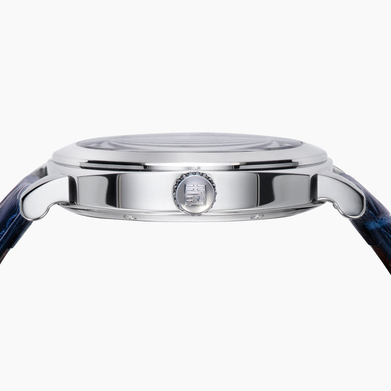 The 41MM Swiss Made Stainless Steel and Leather Automatic Skeleton Watch features a silver case, blue leather strap and bezel, a skeleton dial with visible gears, white hour markers and hands, plus the ERIFY brand name at the top.