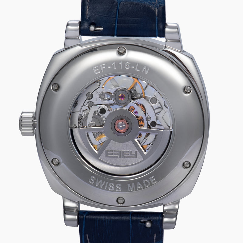 The 41MM Swiss Made Stainless Steel and Leather Automatic Skeleton Watch features a silver case, blue leather strap and bezel, a skeleton dial with visible gears, white hour markers and hands, plus the ERIFY brand name at the top.