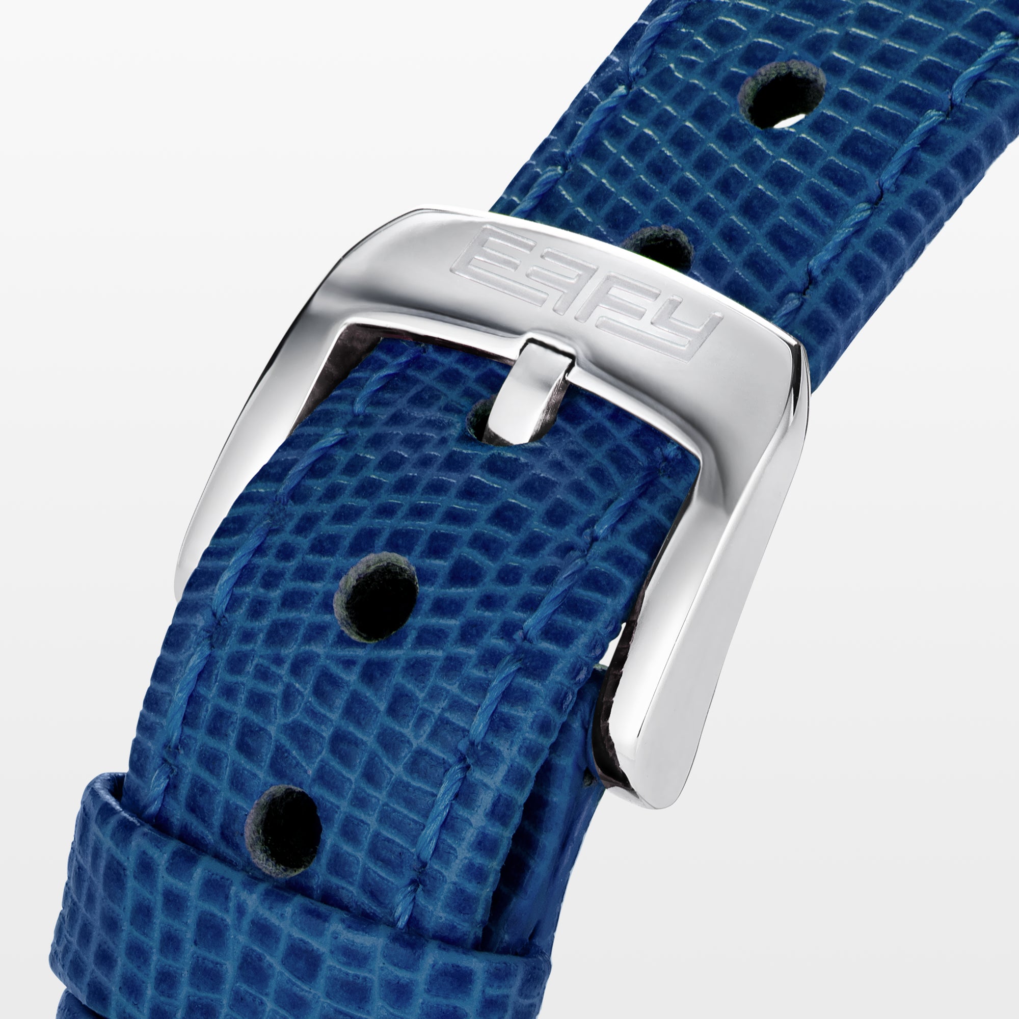 The 28MM Swiss Made Stainless Steel Cocktail Watch features a luxurious oval design with a diamond and blue sapphire-studded face, silver hands, deep blue textured leather strap, and exquisite Swiss craftsmanship.