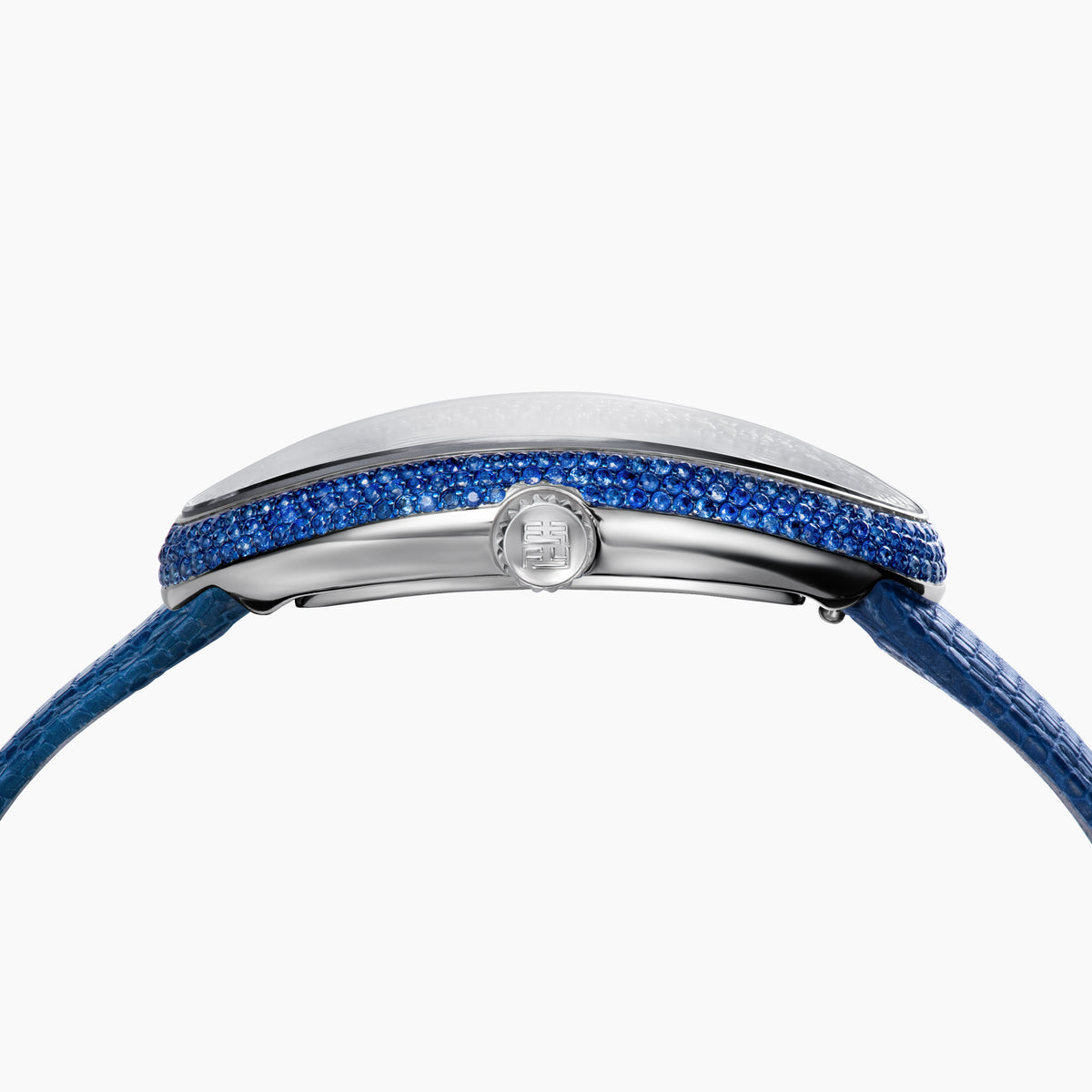 The 28MM Swiss Made Stainless Steel Cocktail Watch features a luxurious oval design with a diamond and blue sapphire-studded face, silver hands, deep blue textured leather strap, and exquisite Swiss craftsmanship.