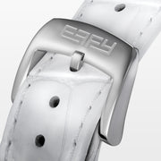 The 39MM Swiss Made Stainless Steel Watch features a white leather strap, mother of pearl dial, diamond-studded face, rainbow sapphire bezel, blue hands, and silver case.