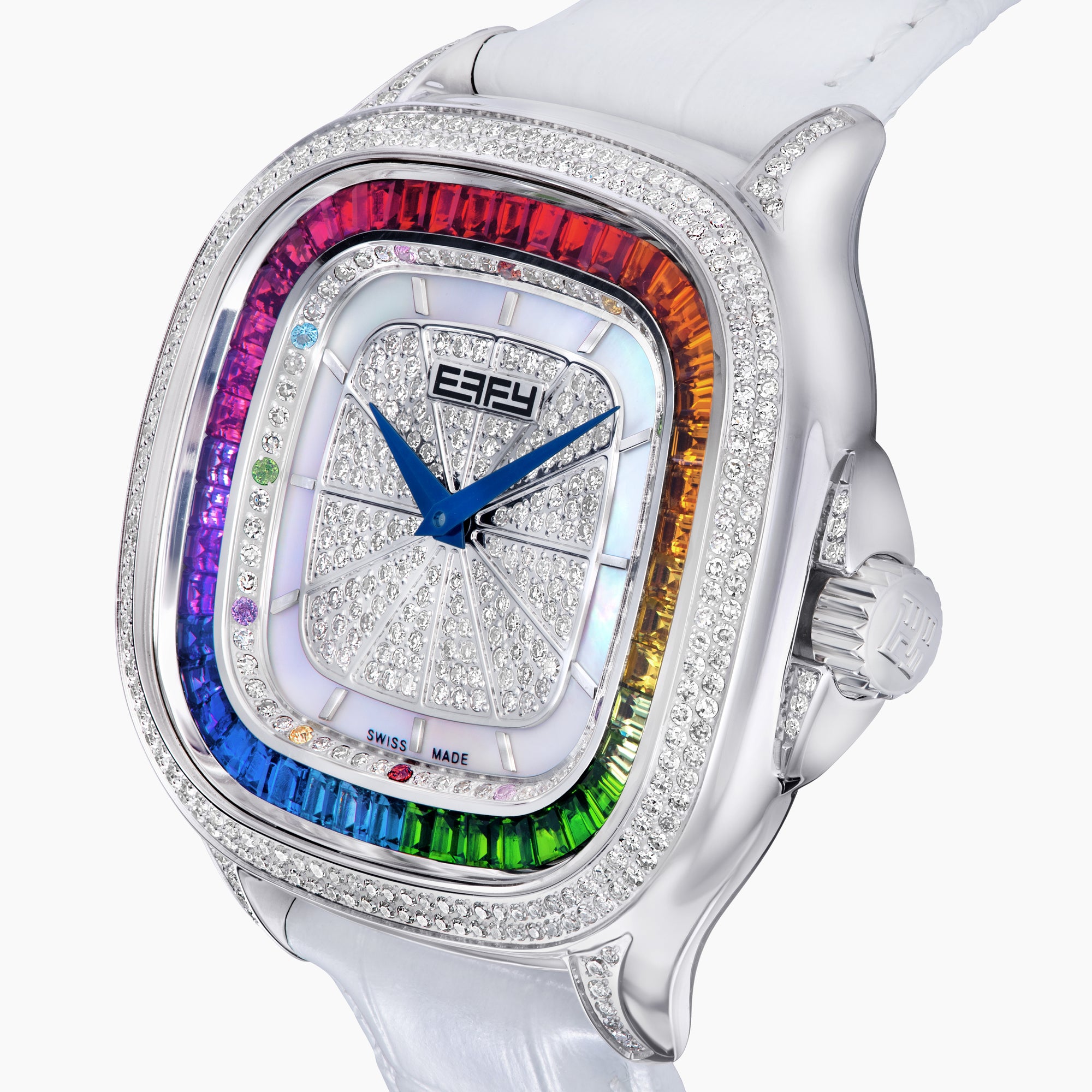The 39MM Swiss Made Stainless Steel Watch features a white leather strap, mother of pearl dial, diamond-studded face, rainbow sapphire bezel, blue hands, and silver case.