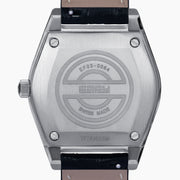 The 36MM Black Dial Swiss Made Titanium Watch with Diamonds features a faceted silver titanium case, black dial adorned with diamond hour markers, and a black leather strap, showcased against a plain white background.