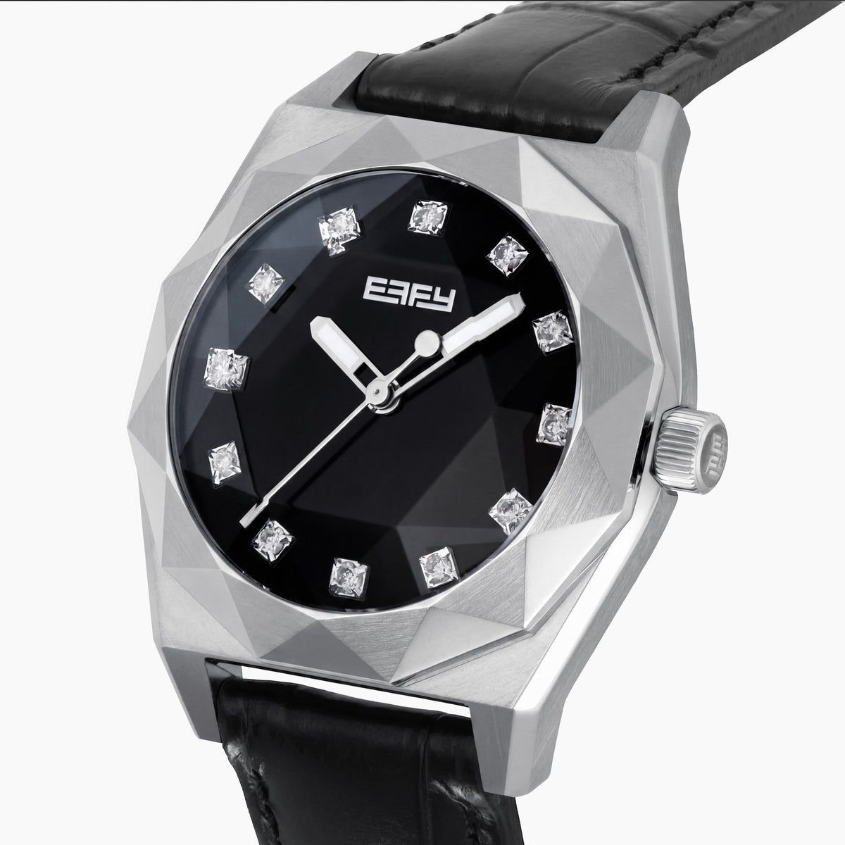 The 36MM Black Dial Swiss Made Titanium Watch with Diamonds features a faceted silver titanium case, black dial adorned with diamond hour markers, and a black leather strap, showcased against a plain white background.