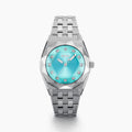Introducing the 36MM Blue Dial Swiss Made Titanium Watch with Diamonds, featuring a sleek titanium strap, an eye-catching turquoise blue dial, silver hour markers, and dazzling diamond accents at each hour position. This exquisite timepiece captures the refined elegance of Swiss craftsmanship and is beautifully displayed on a white background.