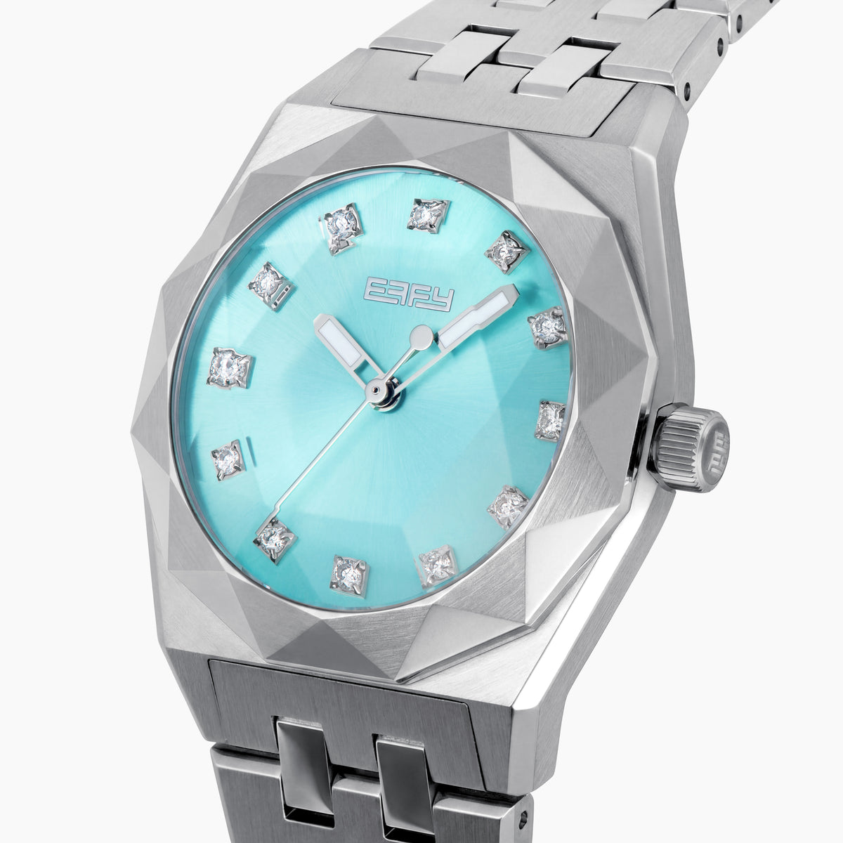 Introducing the 36MM Blue Dial Swiss Made Titanium Watch with Diamonds, featuring a sleek titanium strap, an eye-catching turquoise blue dial, silver hour markers, and dazzling diamond accents at each hour position. This exquisite timepiece captures the refined elegance of Swiss craftsmanship and is beautifully displayed on a white background.