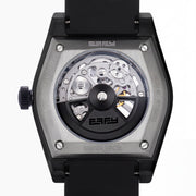 Experience the exceptional craftsmanship of Swiss made watches with the 42MM Swiss Made Black PVD Titanium and Silicone Automatic Skeleton Watch, featuring a geometric-patterned black titanium case, a transparent skeleton dial showcasing intricate inner gears, and a sleek black silicone strap—all elegantly presented against a white background.