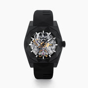 Experience the exceptional craftsmanship of Swiss made watches with the 42MM Swiss Made Black PVD Titanium and Silicone Automatic Skeleton Watch, featuring a geometric-patterned black titanium case, a transparent skeleton dial showcasing intricate inner gears, and a sleek black silicone strap—all elegantly presented against a white background.