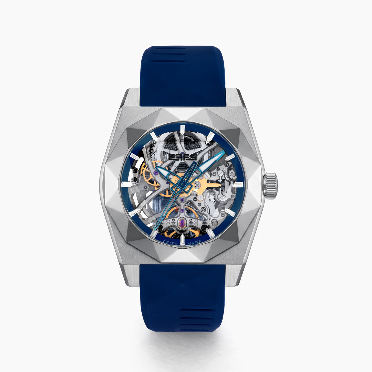 Introducing the 42MM Swiss Made Titanium and Silicone Automatic Skeleton Watch—a luxurious timepiece featuring a geometric silver titanium case and exposed inner mechanisms. Accented with a blue bezel and paired with a blue silicone strap, this design stands out against a white backdrop. Its exceptional clarity and elegance are enhanced by a diamond-cut sapphire crystal.