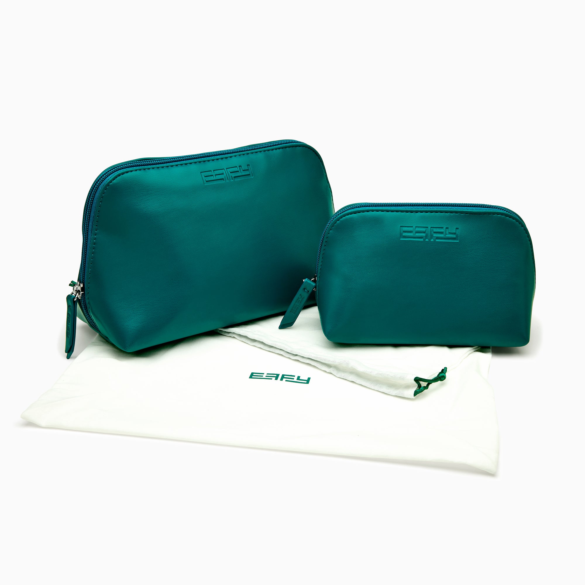 The Effy 2-Piece Travel Pouch set—two teal vegan leather pouches (one large, one small) with embossed logos—is displayed on a white drawstring bag with a matching logo, all set against a plain white background.