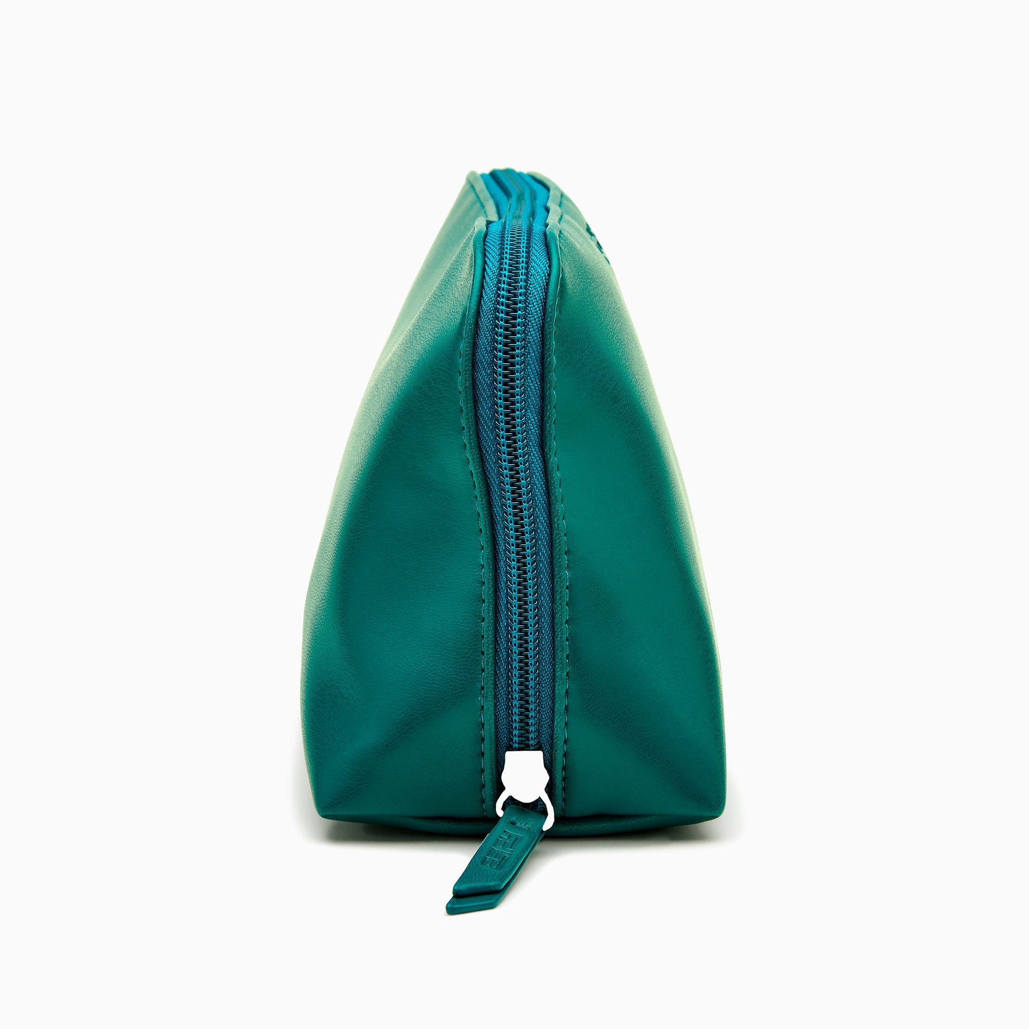 The Effy 2-Piece Travel Pouch set—two teal vegan leather pouches (one large, one small) with embossed logos—is displayed on a white drawstring bag with a matching logo, all set against a plain white background.