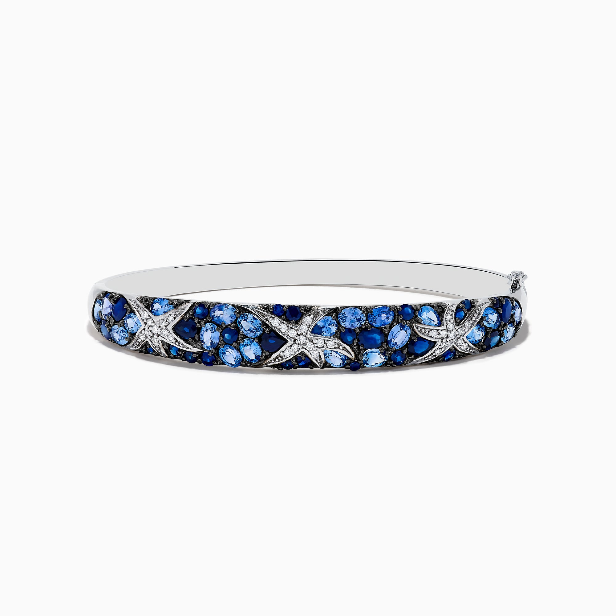 The Seaside 14K White Gold Sapphire & Diamond Starfish Bangle, 8.25 TCW, features blue sapphires and white diamonds in a crisscross pattern for an elegant seaside-inspired look.